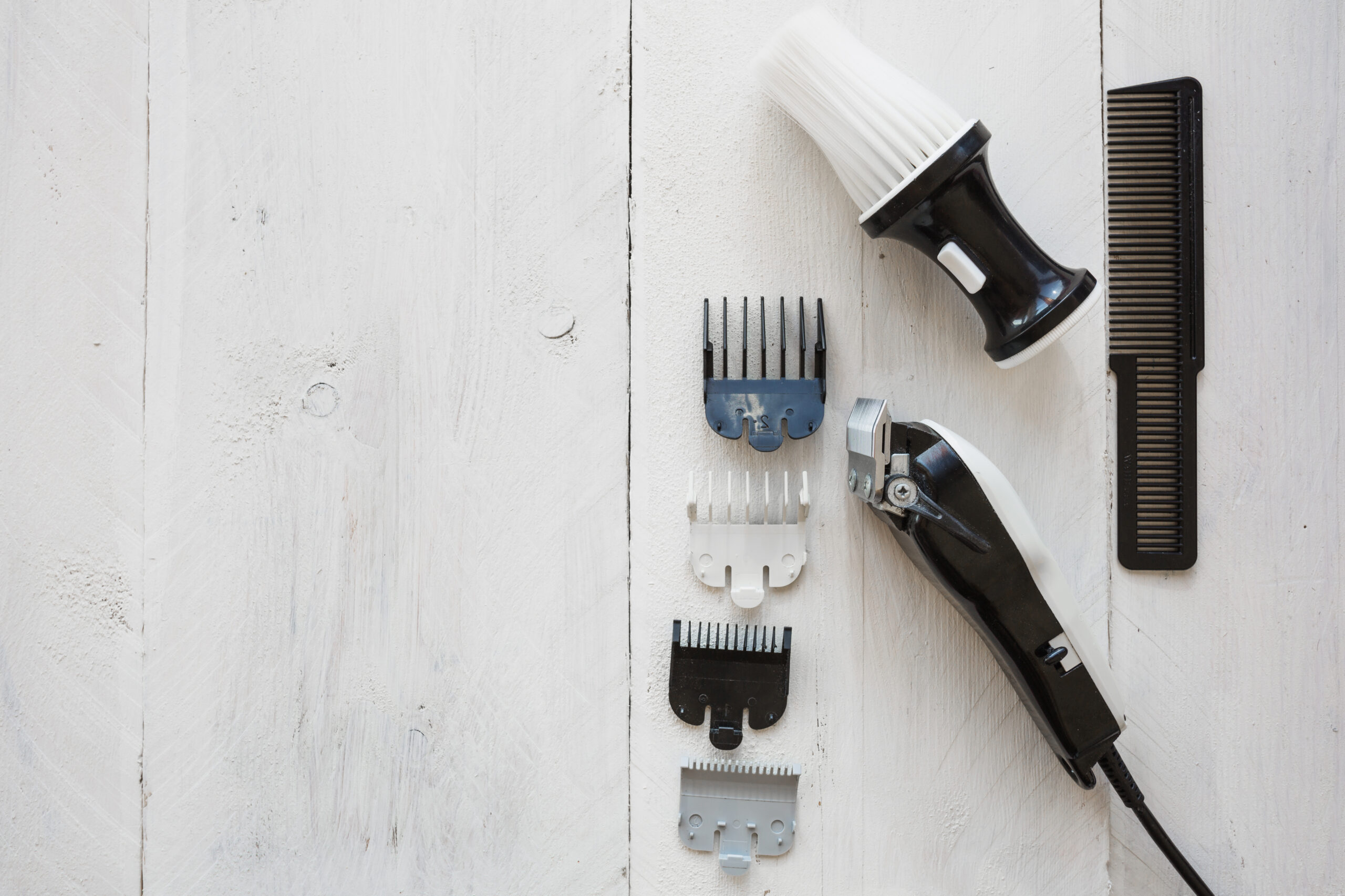 hairdressing-razor-near-brush-comb hairdressing-razor-near-brush-comb